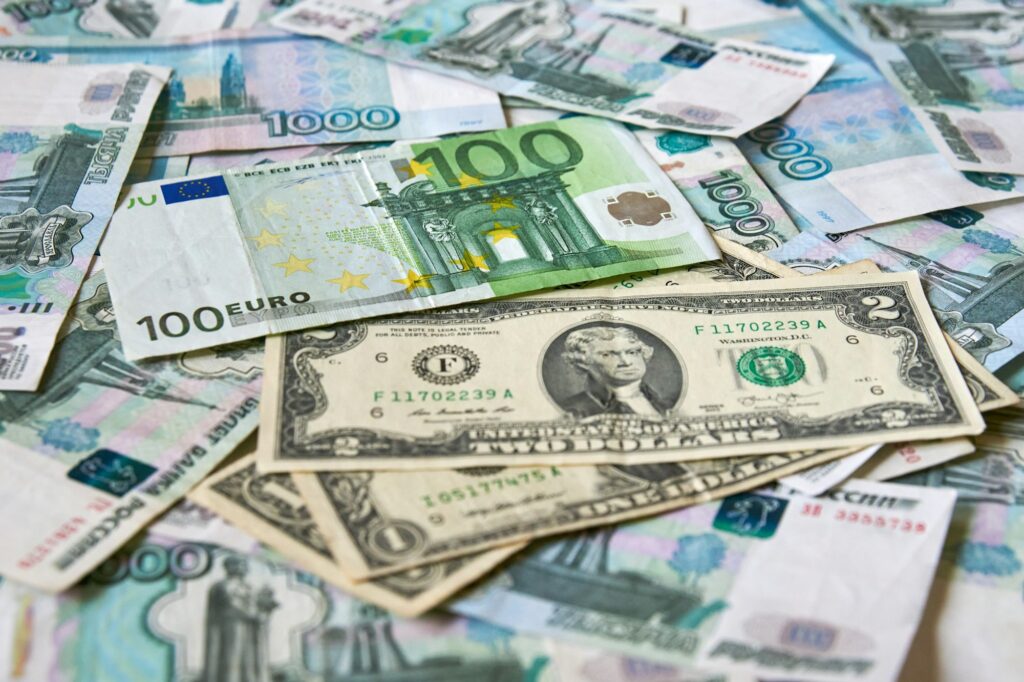 background of paper bills dollars, euros and rubles. Currency exchange rate